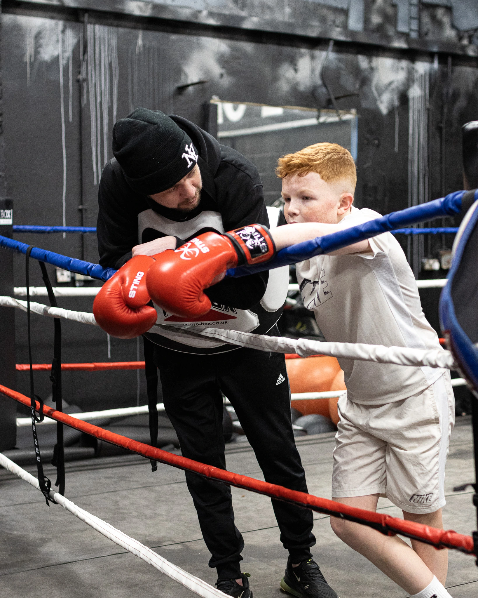 A picture of Michael Green supporting one of his young boxers